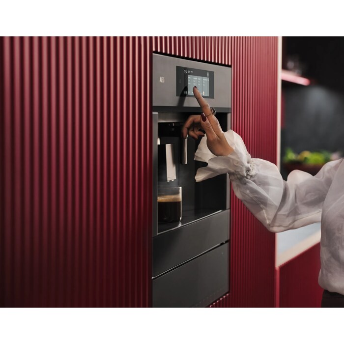 Built-in coffee machine designed to fit flush with kitchen cabinetry for a streamlined look.