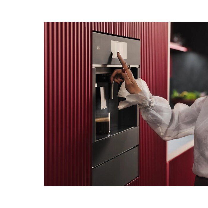 Built-in coffee machine designed to fit flush with kitchen cabinetry for a streamlined look.